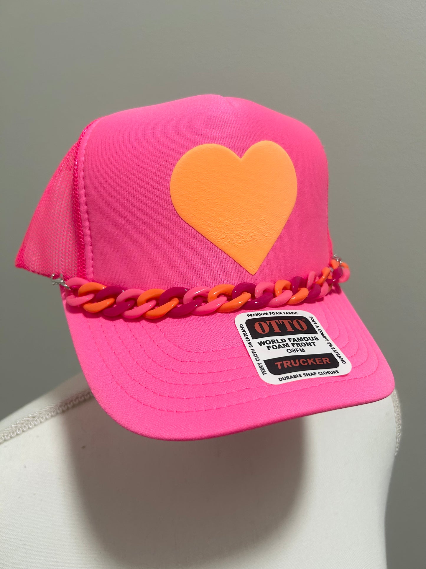 Orange heart trucker hat