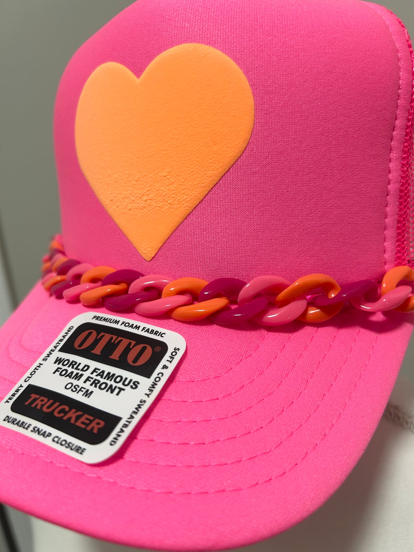 Orange heart trucker hat