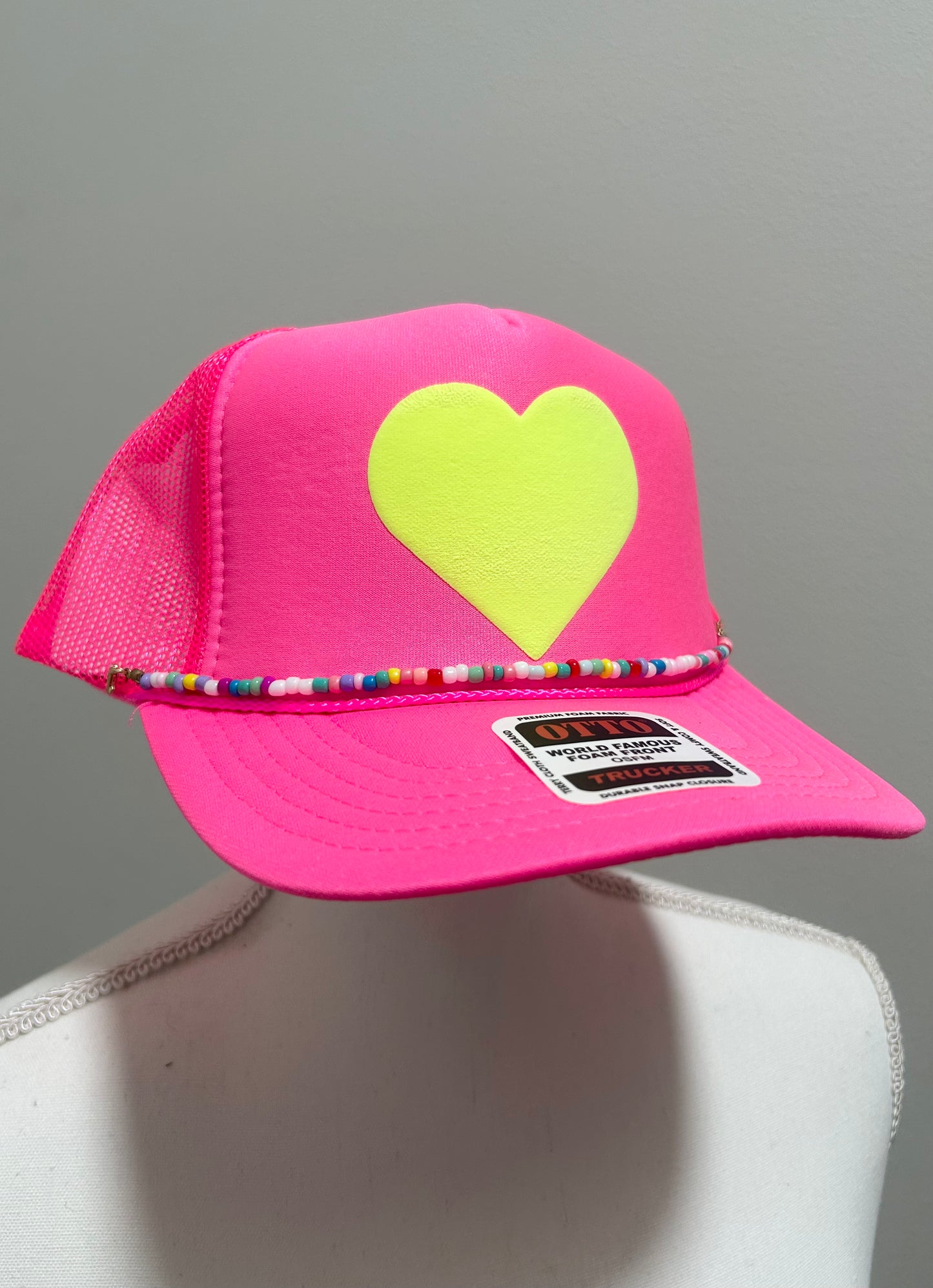 Yellow heart trucker hat