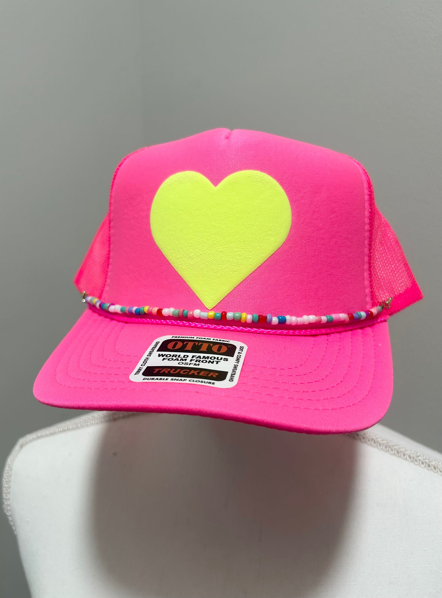 Yellow heart trucker hat